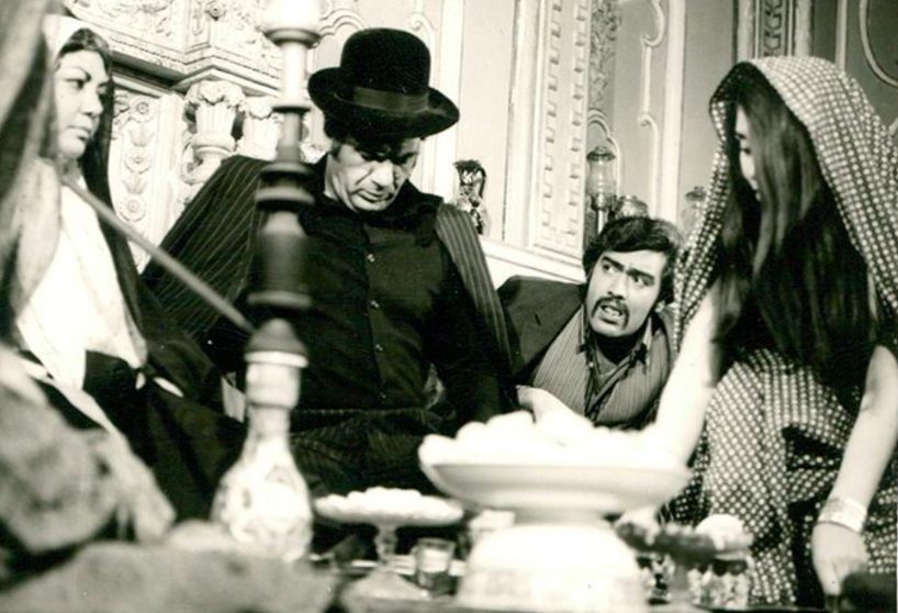 Figure 21: A still from Kākū (Kako), directed by Shāpūr Gharīb, 1971. “The script of Kako (1971) directed by Shāpūr Gharīb, borrows from classic American Western movie tropes: A once-noble man returns to a town he abandoned years ago. In his prime, he was a formidable force for justice—protecting the weak and upholding order. But in his absence, a ruthless usurper seized power, oppressing the very people the hero once swore to defend. Now, his return ignites a spark of hope, rallying the townsfolk against their oppressor.”<sup class="modern-footnotes-footnote " data-mfn="2" data-mfn-post-scope="0000000075d24e54000000000a8d395f_18572"><a href="javascript:void(0)"  role="button" aria-pressed="false" aria-describedby="mfn-content-0000000075d24e54000000000a8d395f_18572-2">2</a></sup><span id="mfn-content-0000000075d24e54000000000a8d395f_18572-2" role="tooltip" class="modern-footnotes-footnote__note" tabindex="0" data-mfn="2">Hasan Tihrānī, “Persian Title of the article,” Tamāshā magazine 11 (1971): PAGE NUMBER </span>