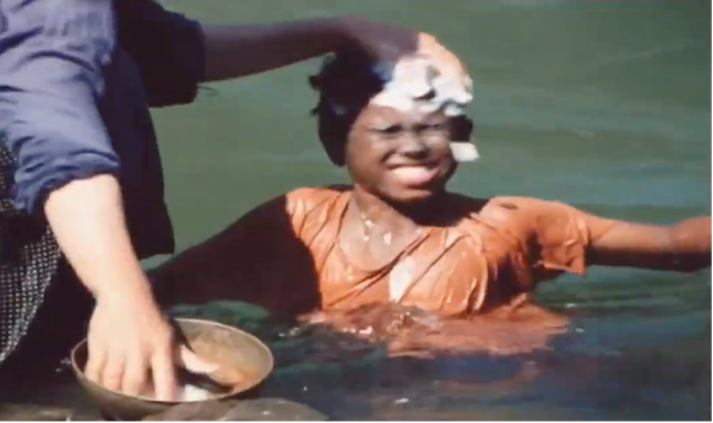 Figure 7: Nā’ī uses water and soap to wash away Bāshū’s skin color. Frame enlargement of a screenshot from the film Bashu, The Little Stranger (Bāshū, Gharībah-yi Kūchak), directed by Bahrām Bayzā’ī, 1986 (00:52:00).