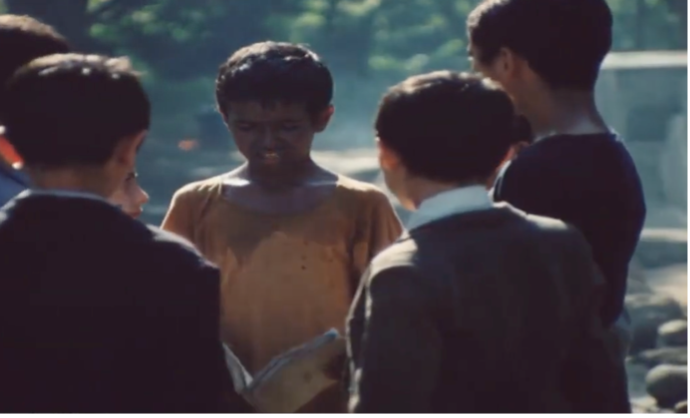 Figure 16: The other children unexpectedly gather around Bāshū to hear his story. Frame enlargement of a screenshot from the film Bashu, The Little Stranger (Bāshū, Gharībah-yi Kūchak), directed by Bahrām Bayzā’ī, 1986 (00:58:52).