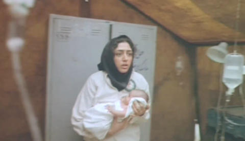 Figure 8: Sipīdah dreaming of holding a baby during the chemical weapons attack. Still from M for Mother (Mīm misl-i mādar), directed by Rasūl Mullāqulīpūr, 2006.