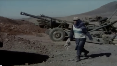 Figure 12: Maryam walking through the former frontlines. Still from The Survivors (Nijāt-yāftagān), directed by Rasūl Mullāqulīpūr, 1996.
