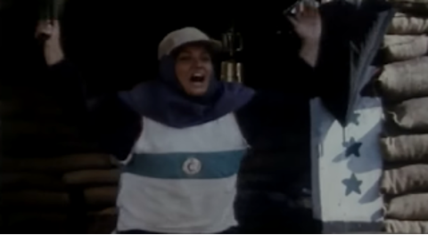 Figure 27: Maryam shouting triumphantly after the ceasefire. Still from The Survivors (Nijāt-yāftagān), directed by Rasūl Mullāqulīpūr, 1996.