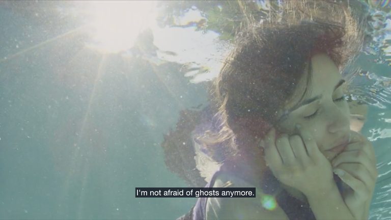 Figure 11: Zaree remains underwater, voice-over narration revealing her thoughts on her experience. Still from Born in Evin, directed by Maryam Zaree, 2019.