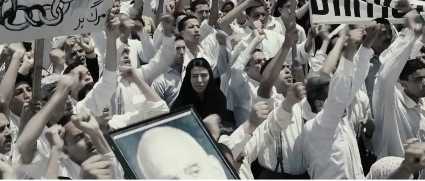 Figure 11: The stark chromatic separation of Mūnis from the street protests. Still from Women Without Men, directed by Shirin Neshat, 2009.